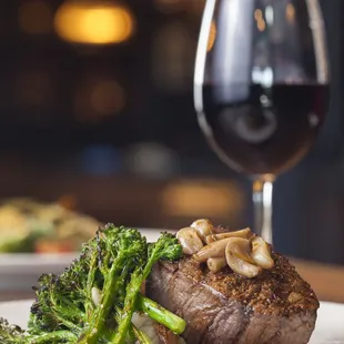 Aspen Ridge filet mignon with smashed potatoes, charred broccolini with rosemary confit garlic, beef au jus.