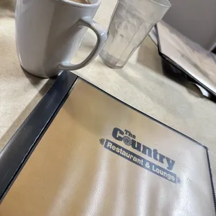 a cup of coffee and menu
