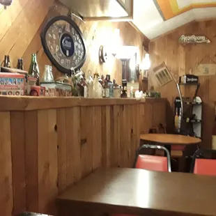 The back bar is all wood. All the locals come in through the back door.