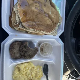 Very cold Pancakes, sausages , eggs and syrup.