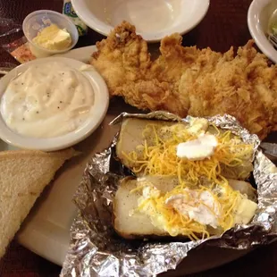 Chicken fried chicken with baked potato and cream gravy...Yumm