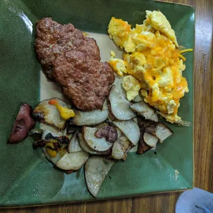 A scrambled egg medley with home fries and a side of hot Patty&apos;s