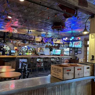 a bar with a lot of tables and chairs