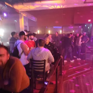 a crowd of people at a bar