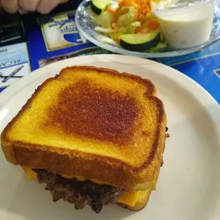 Patty melt and side salad .
