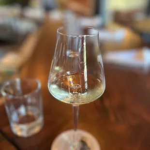a glass of wine on a table