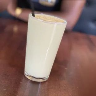 a glass of milk on a table