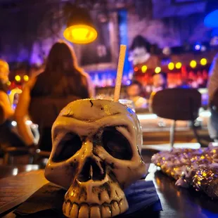 a skull with a cigarette in its mouth