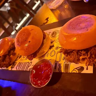 three burgers with ketchup and ketchup