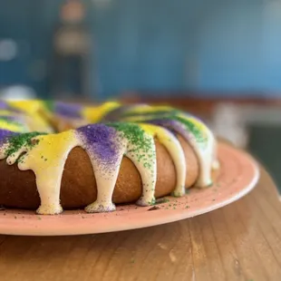 Homemade king cake with cream cheese frosting