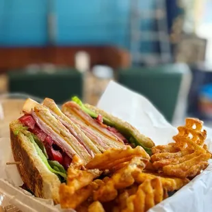 Club sandwich with seasoned waffle fries