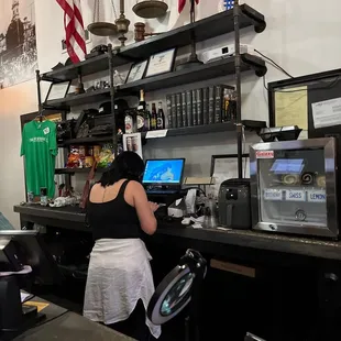 a woman behind the counter