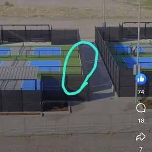 The balls roll through the gaps between court divider fencing and main perimeter fencing.