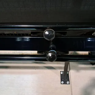 Paddle rack inside Spectator Seating Area. Insert paddle inside rack. 2 rows in each rack.