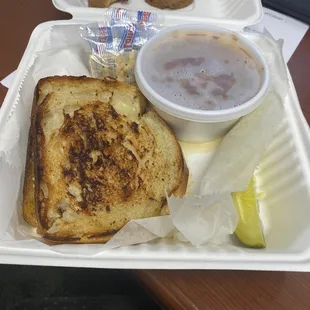 #14 Grilled "Muffale-Cheesy" with Genoa salami and ham melt with smoked Gouda, provolone and gardineria pesto on sourdough.