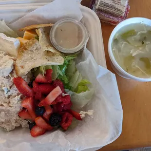 Trio Salad with tuna salad and raspberry vinaigrette dressing. Side of the Lemon Chicken soup with jasmine rice and local snap peas.