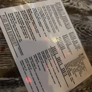 a menu on a wooden table