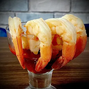 a shrimp cocktail in a shot glass