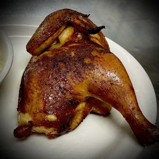 a cooked chicken on a plate