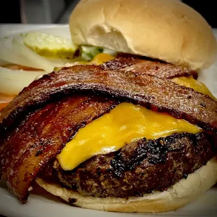 a burger with bacon and cheese