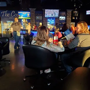 a group of people sitting around a table