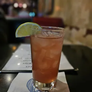 a drink with a slice of lime on the rim