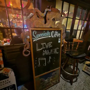 a chalkboard sign in a restaurant