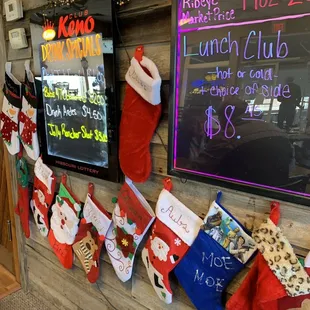 Xmas stockings hung by the menus w care