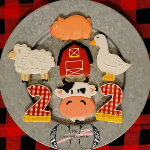 a plate of farm themed cookies