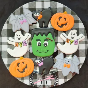 a plate of decorated halloween cookies