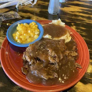 Open face hot beef sandwich, mashed potatoes and a vegetable and salad. $9.99.