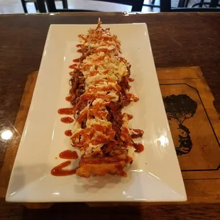 Crispy "sweet" waffle fries smothered in pulled pork BBQ and coleslaw.