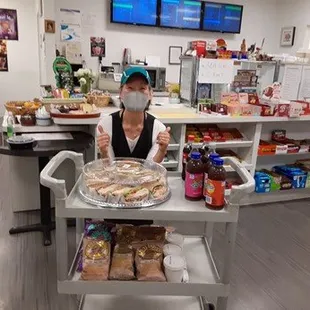 Sonia (owner of Cozy Deli) and a catering sandwich tray
