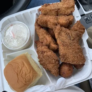 Catfish , hush puppies and slaw .