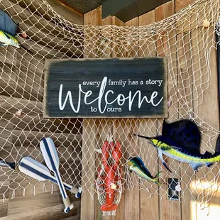 a welcome sign and fish