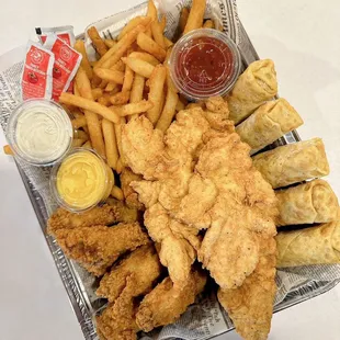 a basket of fried fish and fries