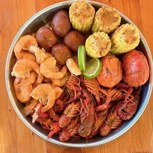 a bowl of seafood and potatoes
