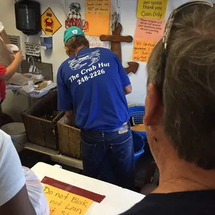 a group of people in a kitchen