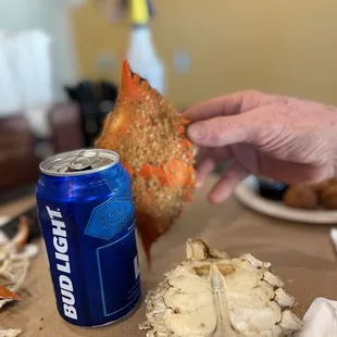  a crab and a can of beer