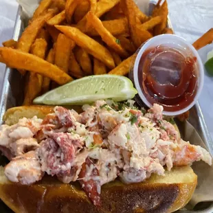 Lobster roll with sweet potato fries.