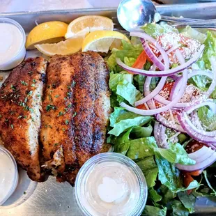 Blackened Catfish, Dirty Rice, Salad with a side of Tartar Sauce.