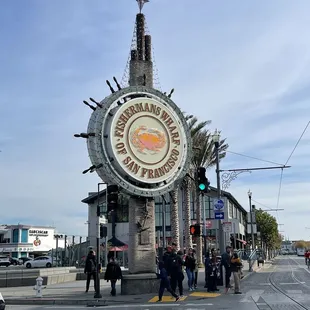 people crossing the street in front of it