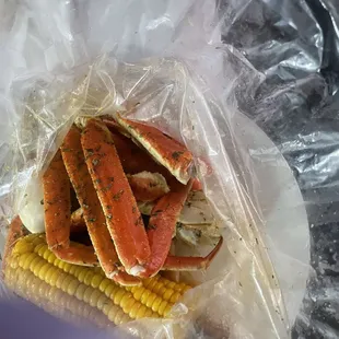 crab legs and corn on the cob