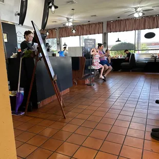 a woman and a child in a restaurant