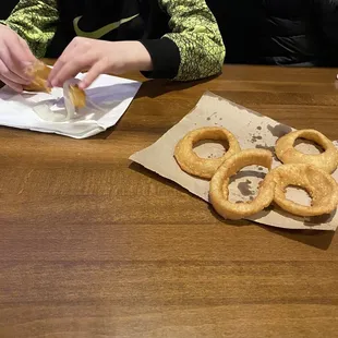 Server brought us onion rings but no plates. We had to use napkins and she never came out to check