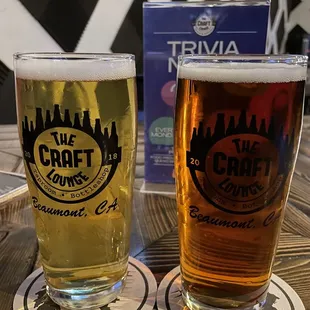 two glasses of beer on a table