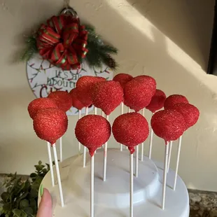Red cake pops with sanding sugar