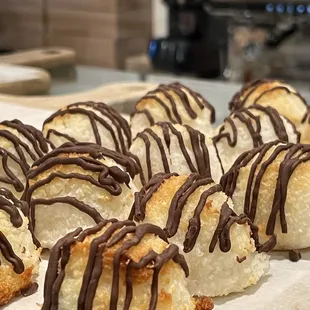 chocolate drizzled on top of coconut balls