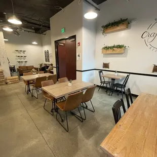 a dining area with tables and chairs