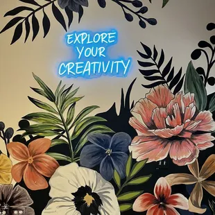 a neon sign that says explore your creativity